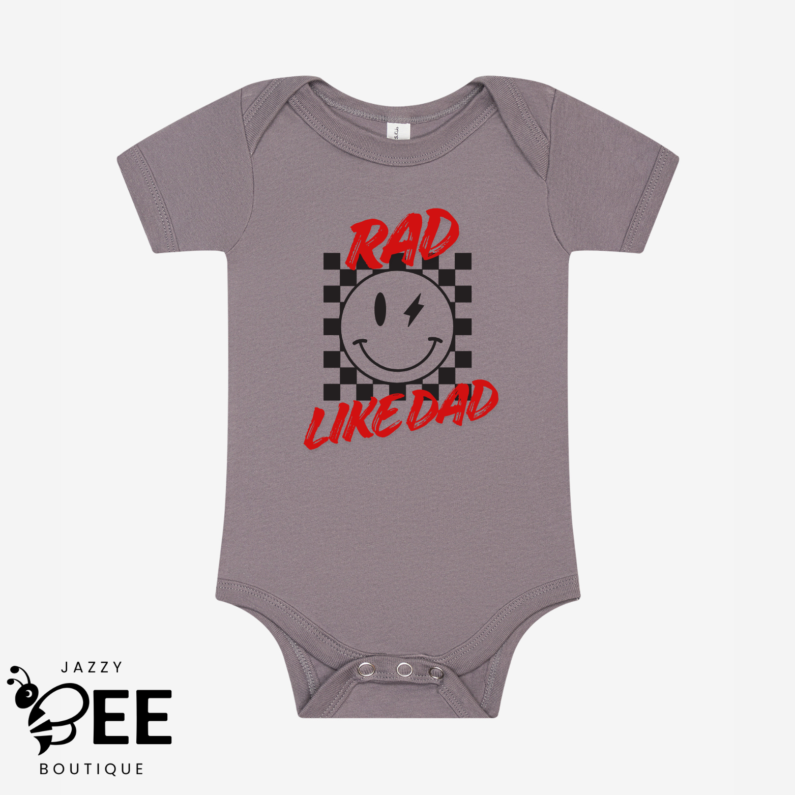 Gray baby onesie with a smiley face and text design on a white background, featuring the brand 'Jazzy Bee Boutique'.