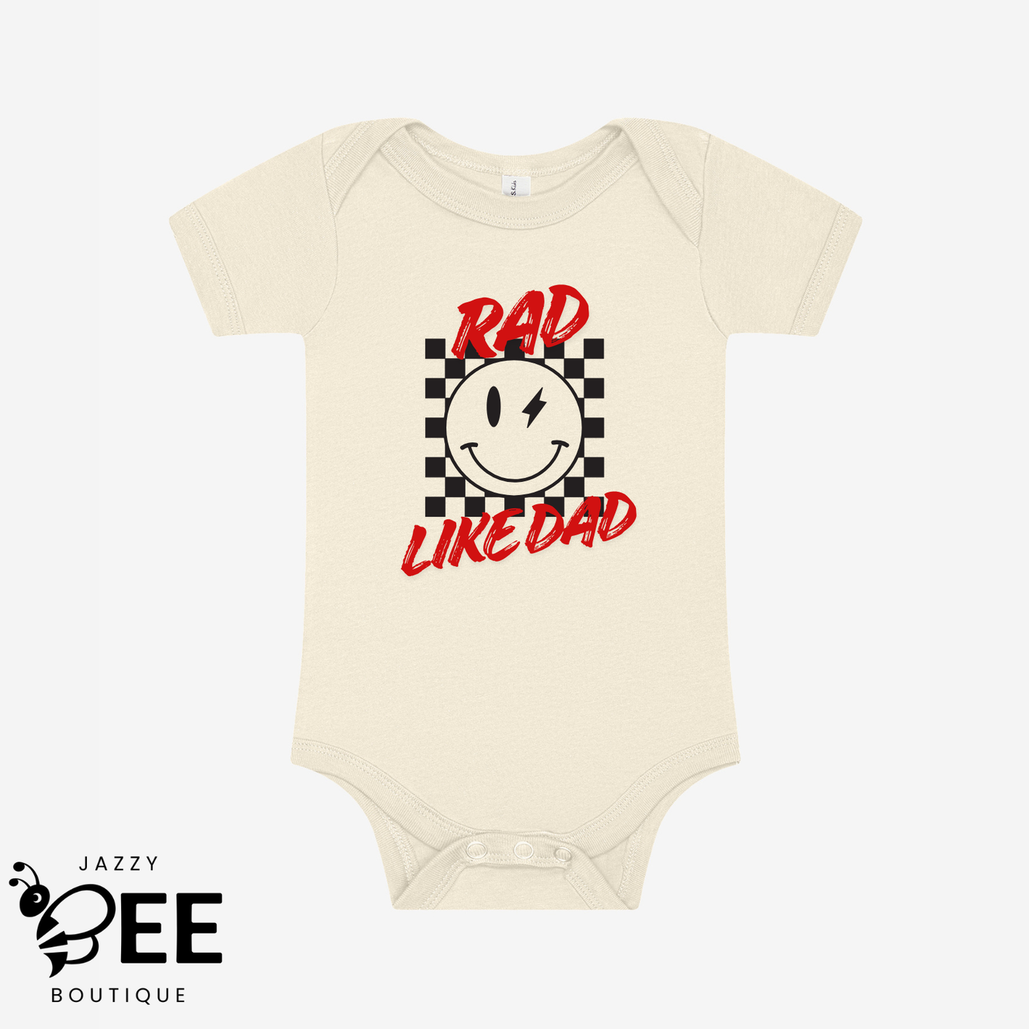 Natural baby onesie with a smiley face and text 'Rad Like Dad' on a white background, featuring the brand 'Jazzy Bee Boutique'.