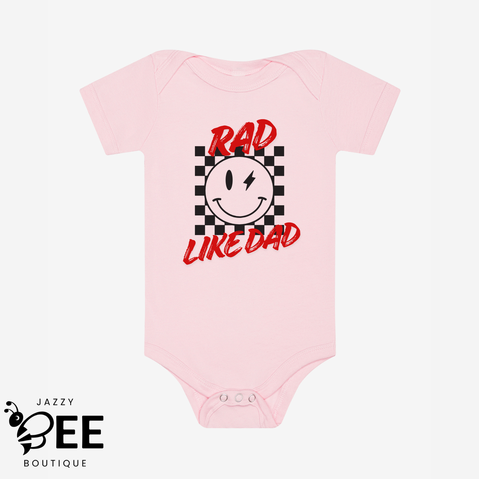 Pink baby onesie with a smiley face and text on a white background, featuring the brand 'Jazzy Bee Boutique'.
